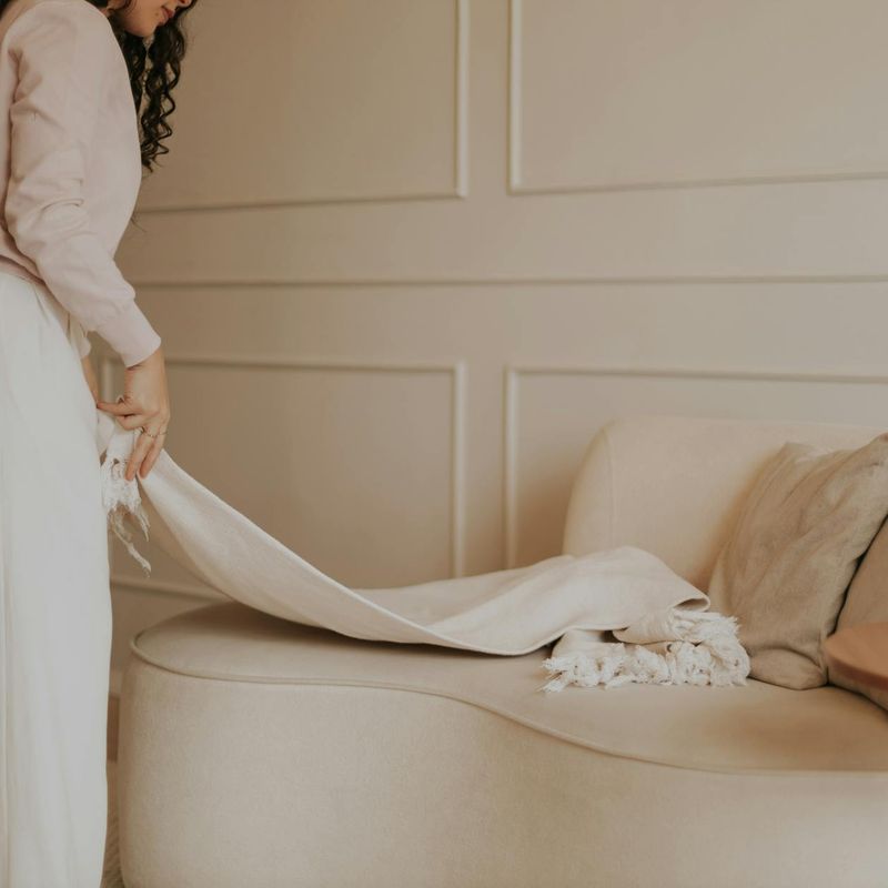Wide shot of a minimalist exercise room with soft lighting.